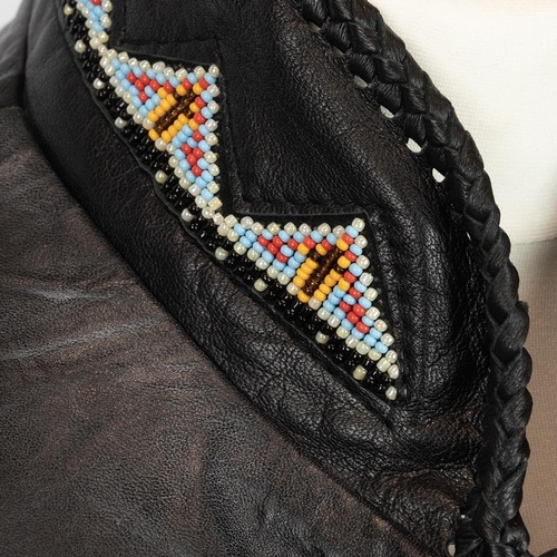 301 - Western style leather jacket with fringe and bead work to the shoulder and arms, sizes S.