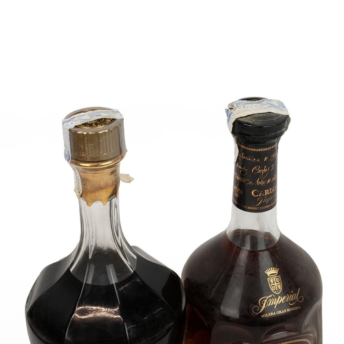 396 - Carlos I Imperial Brandy 70cl 38% alc/vol in decanter bottle with glass stopper in attached leather ... 