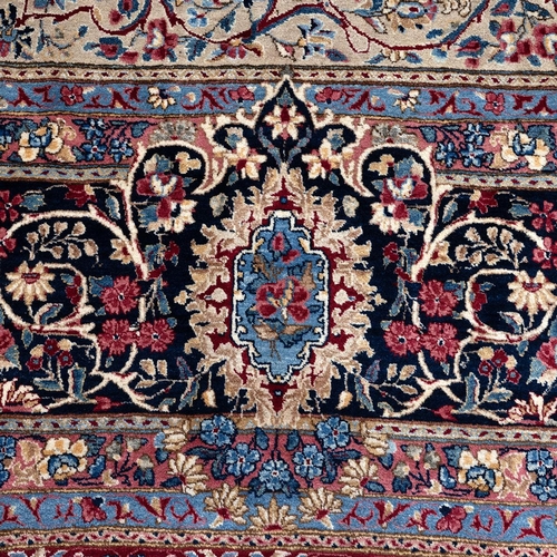 410 - Large early 20th-century Iranian Kerman carpet, decorated with a central medallion on a red and crea... 