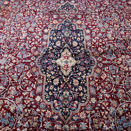 410 - Large early 20th-century Iranian Kerman carpet, decorated with a central medallion on a red and crea... 