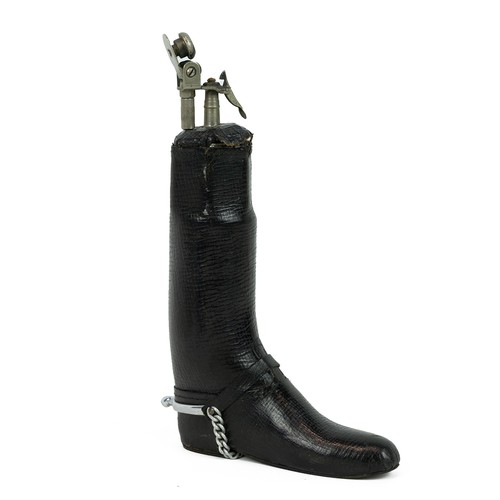 421 - Leather clad table lighter in the form of a jockey's boot complete with spurs, H17cm. Also a table t... 