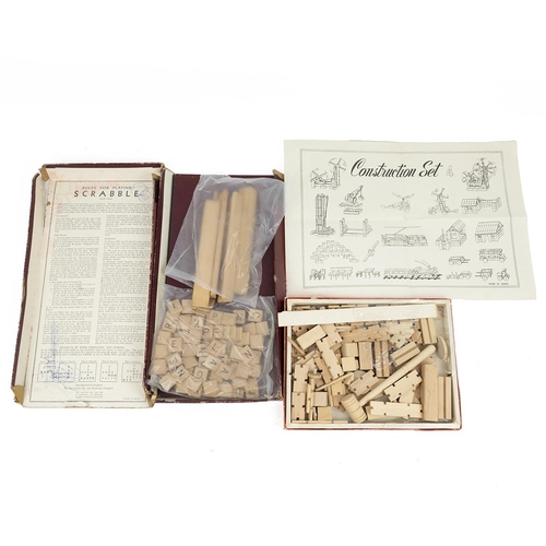 428 - Two woven silk Stevengraphs, a vintage scrabble set, wooden construction set, two first edition copi... 