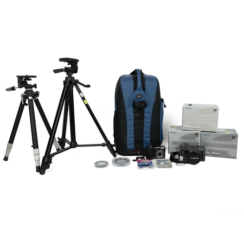 451 - Three Zuiko Digital Lenses in original boxes, two tripods an Olympus SP-350 and an Olympus 300 super... 