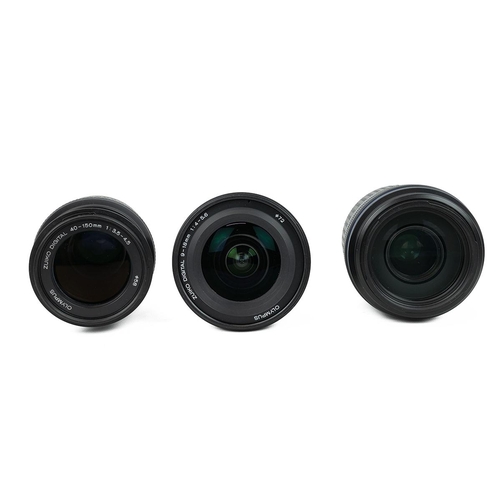 451 - Three Zuiko Digital Lenses in original boxes, two tripods an Olympus SP-350 and an Olympus 300 super... 