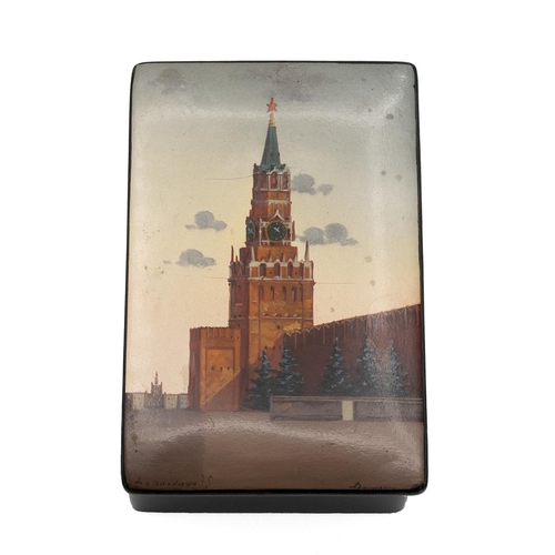 465 - Russian painted lacquered box depicting the Kremlin Moscow Red Square, signed 8.5cm x 13.5cm.