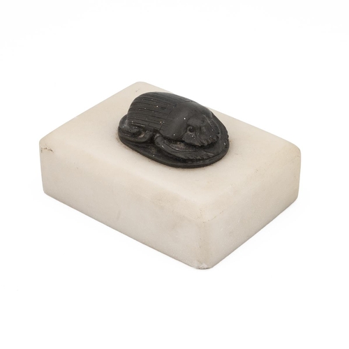 469 - A replica Egyptian scarab beetle on marble base, 8.5cm x 6.5cm the base.