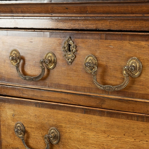 492 - A Georgian inlaid oak chest on stand the drawer fronts with an inlaid boarder and brass drop handles... 