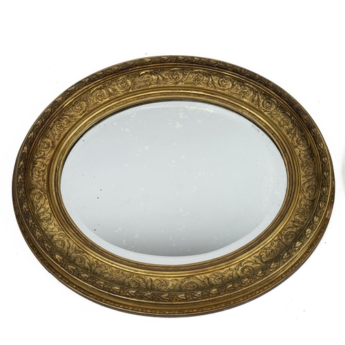 493 - Italian style oval gilt framed wall mirror with ribbon decoration L86cm and a deep set gilt framed w... 