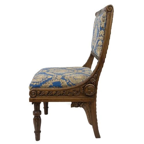 498 - East Asian heavily carved hall chairs with allover leaf and acanthus decoration, raised on turned le... 