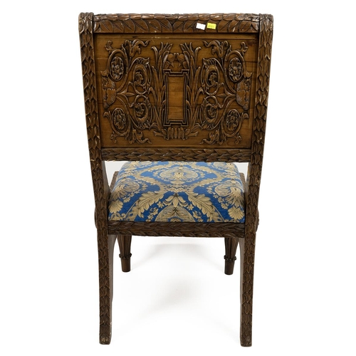 498 - East Asian heavily carved hall chairs with allover leaf and acanthus decoration, raised on turned le... 