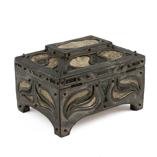 502 - An Art Nouveau Pewter Vellum and Snakeskin sarcophagus shaped casket raised on bracket supports, pen... 