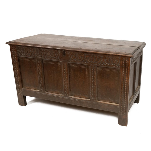 506 - Georgian 18th Century oak coffer with carved decoration to the panelled front the hinged lid with or... 