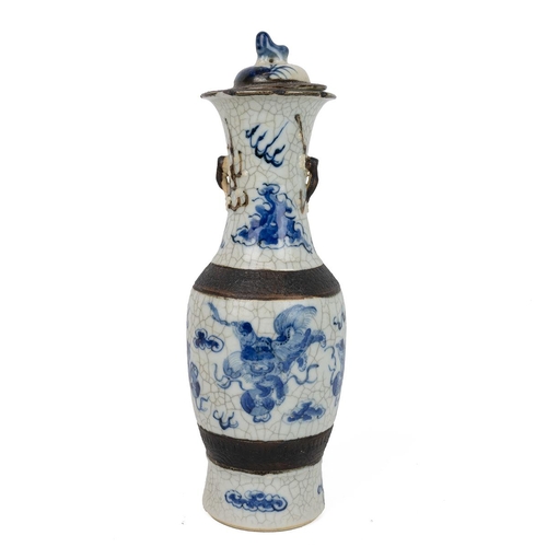 144 - A CHINESE BLUE AND WHITE PORCELAIN VASE AND COVER, LATE QINGOf baluster form with fluted rim, lid wi... 