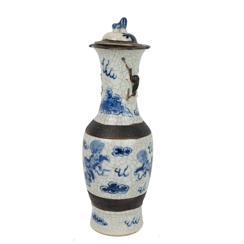 144 - A CHINESE BLUE AND WHITE PORCELAIN VASE AND COVER, LATE QINGOf baluster form with fluted rim, lid wi... 