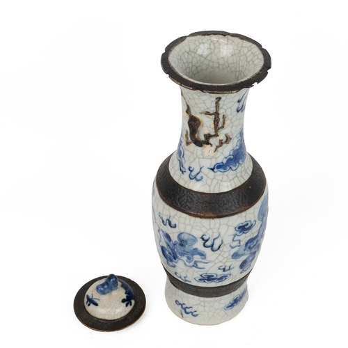 144 - A CHINESE BLUE AND WHITE PORCELAIN VASE AND COVER, LATE QINGOf baluster form with fluted rim, lid wi... 