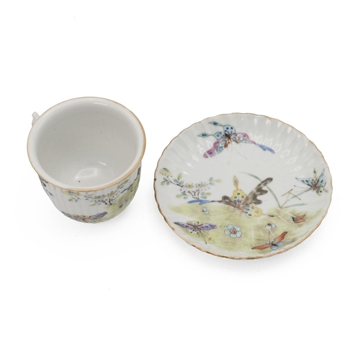 90 - A CHINESE FAMILLE ROSE TEA SET, 19TH CENTURYDecorated with butterflies flying among flowers and gras... 