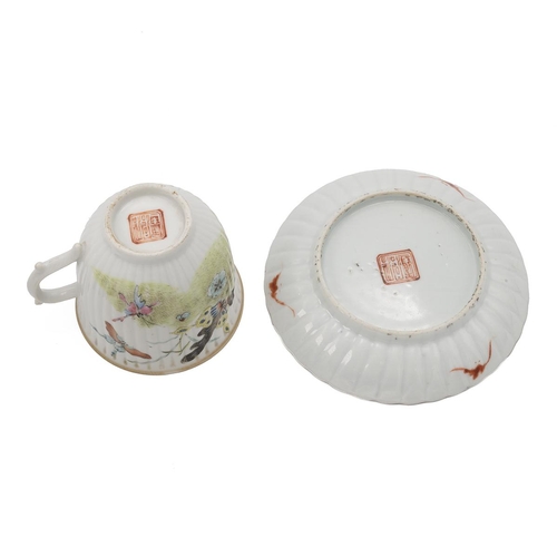 90 - A CHINESE FAMILLE ROSE TEA SET, 19TH CENTURYDecorated with butterflies flying among flowers and gras... 