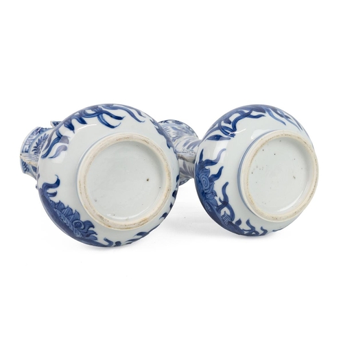 158 - A PAIR OF CHINESE BLUE AND WHITE TWIN HANDLED VASES 18TH CENTURYAfter a Venetian glass prototype, ea... 