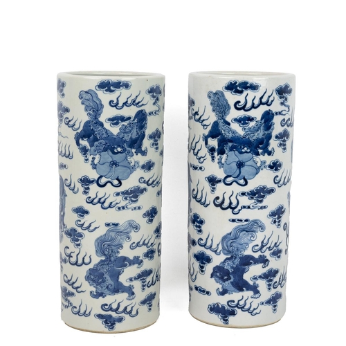 166 - A PAIR OF CHINESE BLUE AND WHITE VASES, 20TH CENTURYOf cylindrical form decorated with Dogs of Foo a... 