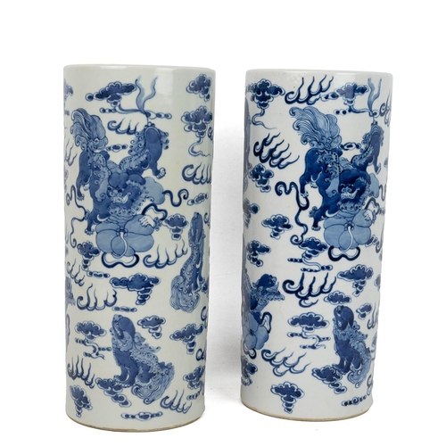 166 - A PAIR OF CHINESE BLUE AND WHITE VASES, 20TH CENTURYOf cylindrical form decorated with Dogs of Foo a... 