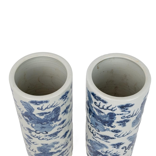 166 - A PAIR OF CHINESE BLUE AND WHITE VASES, 20TH CENTURYOf cylindrical form decorated with Dogs of Foo a... 