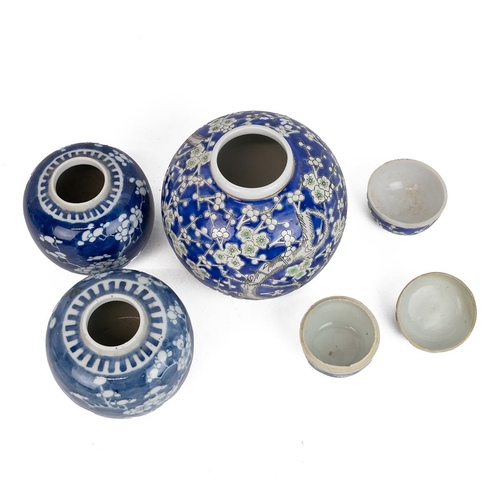 45 - FOUR CHINESE BLUE & WHITE JARS, 19/20TH CENTURY.Each decorated with Plum Flowers. Two without li... 