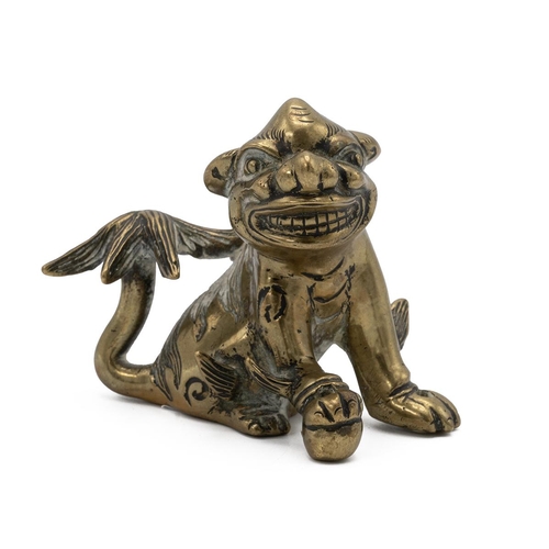 348 - SMALL CHINESE BRASS SHISHI DOG, LATE QING Well cast. Width 8cm, height 6cm.