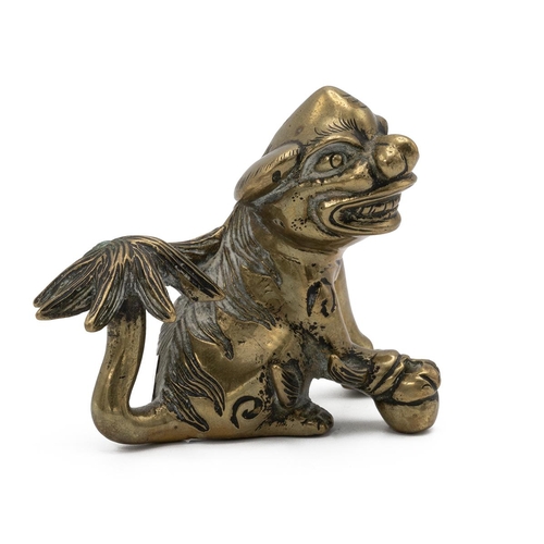 348 - SMALL CHINESE BRASS SHISHI DOG, LATE QING Well cast. Width 8cm, height 6cm.