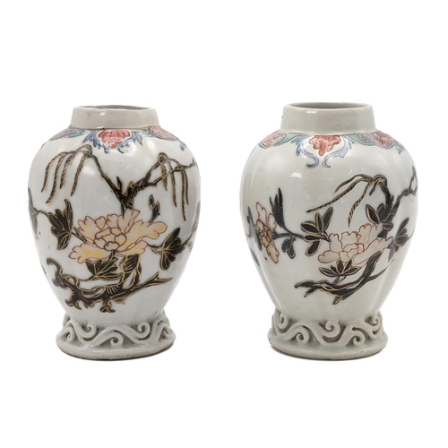 171 - A PAIR OF CHINESE FAMILLE ROSE VASES, 18TH CENTURYOf slightly ridged form, Gualeng Ping, raised on f... 