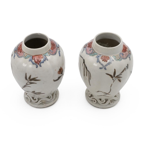 171 - A PAIR OF CHINESE FAMILLE ROSE VASES, 18TH CENTURYOf slightly ridged form, Gualeng Ping, raised on f... 