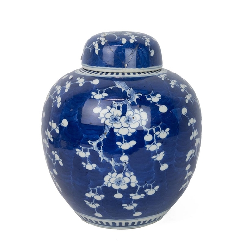 72 - A LARGE CHINESE BLUE AND WHITE GINGER JAR WITH COVER, QING DYNASTYWhite flowering plum tree on deep ... 