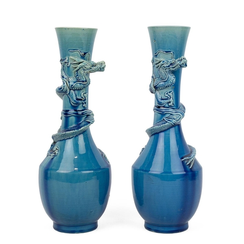 181 - A PAIR OF CHINESE VASES WITH DRAGONS, 19TH CENTURYTurquoise blue glazed baluster form vases with tal... 