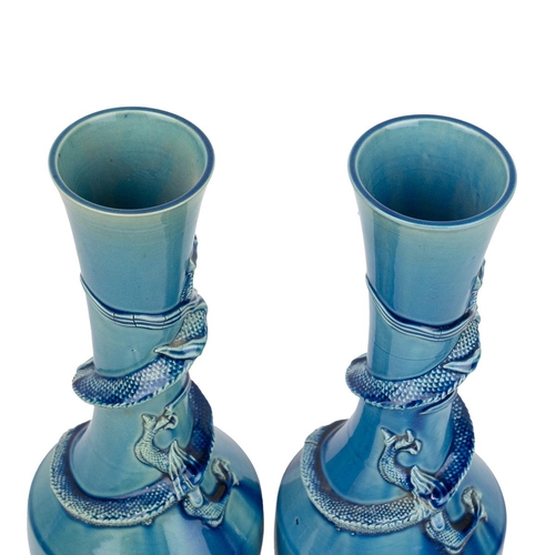 181 - A PAIR OF CHINESE VASES WITH DRAGONS, 19TH CENTURYTurquoise blue glazed baluster form vases with tal... 