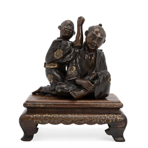 352 - A JAPANESE BRONZE FIGURAL GROUP DEPICTING A MASSEUR AND HIS CLIENT, MEIJI PERIOD Parcel gilt, depict... 