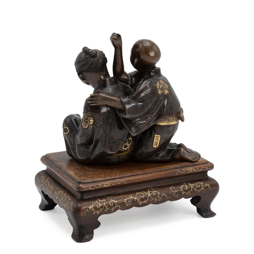 352 - A JAPANESE BRONZE FIGURAL GROUP DEPICTING A MASSEUR AND HIS CLIENT, MEIJI PERIOD Parcel gilt, depict... 