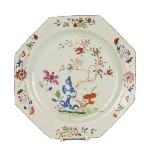 12 - A CHINESE FAMILLE ROSE OCTAGONAL PLATE 18TH CENTURY.Decorated with garlands of flowers and a central... 