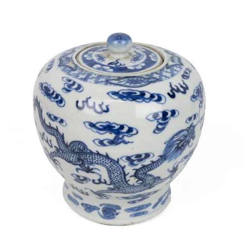 15 - A CHINESE BLUE AND WHITE JAR WITH COVER, 19TH CENTURYDecorated with dragons playing with a fireball ... 