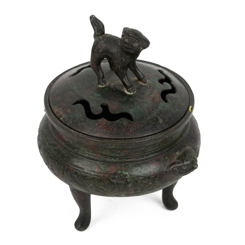 344 - A SMALL CHINESE SCHOLAR'S DESK BRONZE CENSER AND COVER, QING DYNASTYRaised on tri-feet, the body dec... 