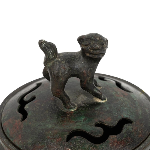 344 - A SMALL CHINESE SCHOLAR'S DESK BRONZE CENSER AND COVER, QING DYNASTYRaised on tri-feet, the body dec... 