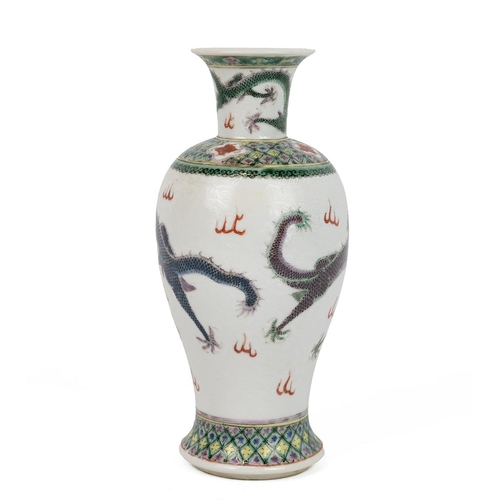 37 - A CHINESE FAMILLE VERTE VASE, 19TH CENTURYOf baluster shape with both mouth and foot rims flared, de... 