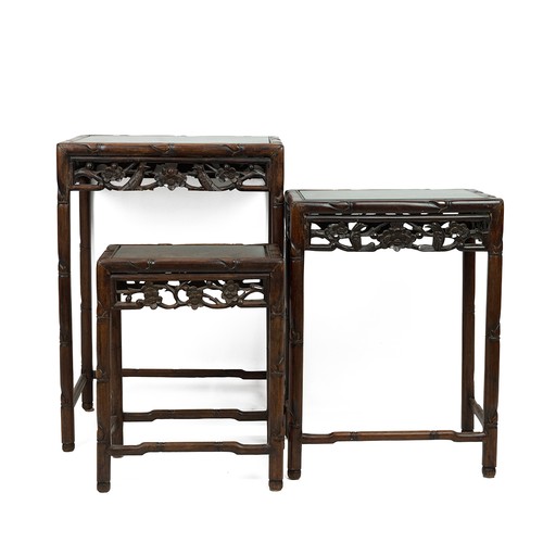 220 - A NEST OF THREE CHINESE ROSEWOOD SIDE TABLES, 19TH CENTURY.With glass inset to the top. Incorporatin... 