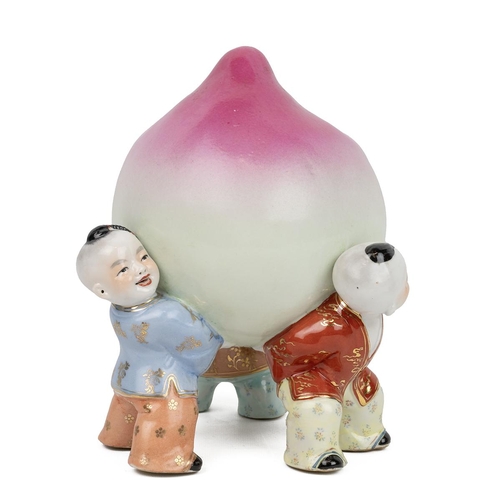 1 - A LARGE CHINESE PORCELAIN WORK OF BOYS LIFTING A PEACH, 19TH CENTURYThree boys lifting a giant peach... 