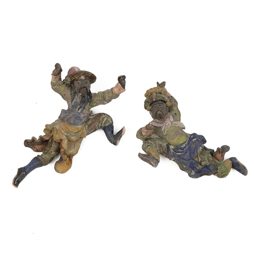 6 - A PAIR OF CHINESE CERAMIC SCULPTURES, QING DYNASTYIn the image of soldiers, possibly parts of a buil... 