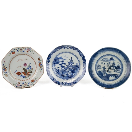 111 - THREE CHINESE PORCELAIN PLATES, QING DYNASTYThe famille rose plate, of hexagonal form, decorated wit... 