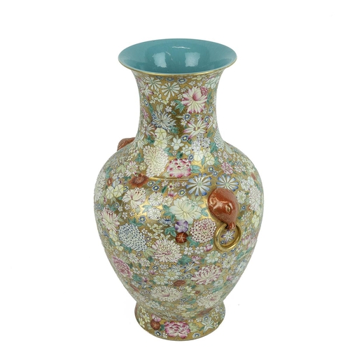 50 - A CHINESE FAMILLE ROSE VASE, 18TH CENTURYA variety of floral heads, peonies, lilies, roses and chrys... 