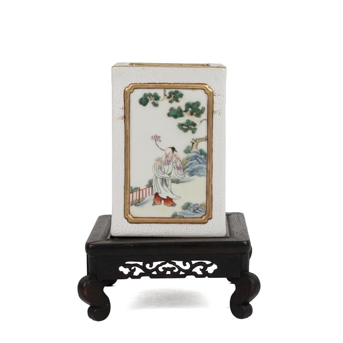 51 - A CHINESE FAMILLE ROSE PEN HOLDER WITH WOODEN STANDOf a square column form, each side decorated with... 