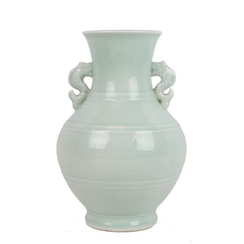 151 - A CHINESE CELADON VASEOf baluster form with fish scroll handles to the side, H25.5cm.Provenance: A W... 