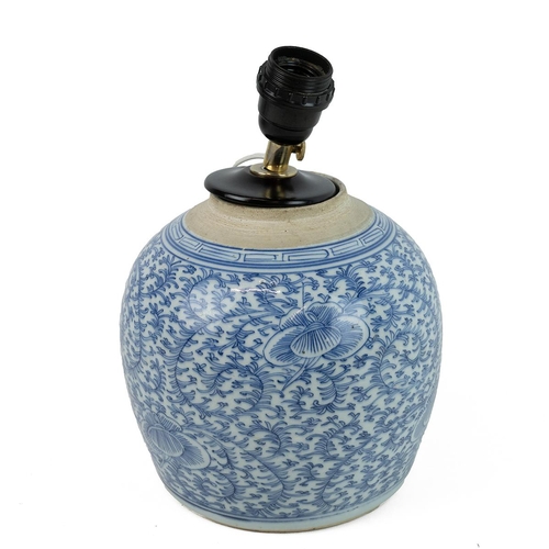 21 - A CHINESE BLUE AND WHITE PORCELAIN JAR, MID QING DYNASTYDecorated fully on the body with scrolling l... 