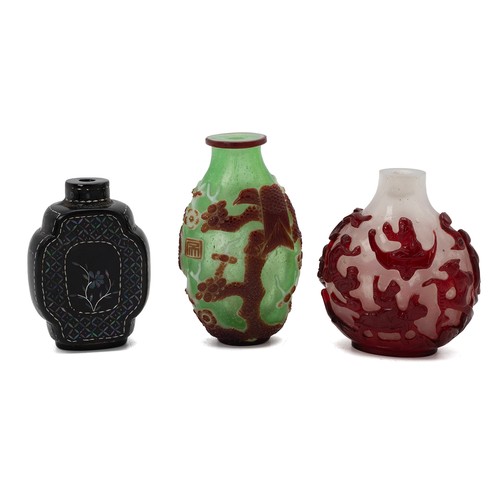 207 - THREE CHINESE SNUFF BOTTLES, QING DYNASTYThe first of slender form with decoration of  a crane and e... 