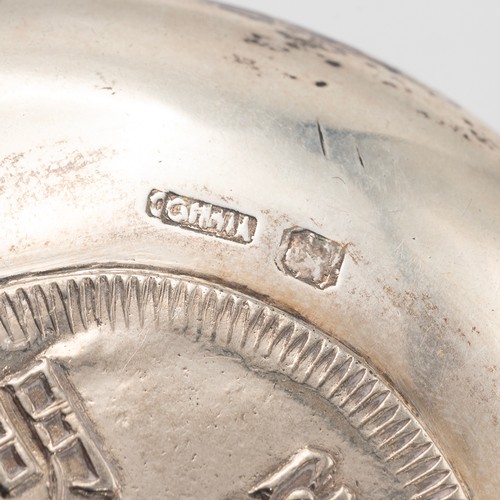 361 - VIETNAMESE SILVER DISH WITH A COIN TO THE WELL.The dish of circular form, the coin decorated with a ... 